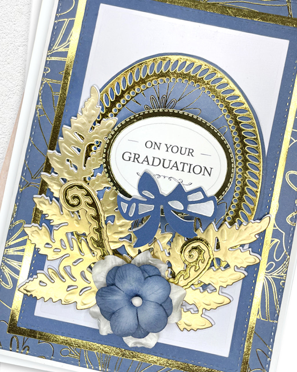 Detail shot of luxury handmade graduation card by Del Cards NZ, premium layered papers and fine gems