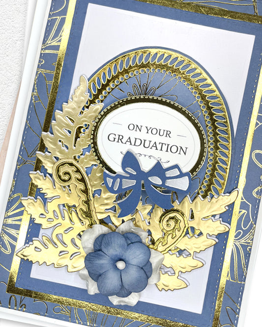 Detail shot of luxury handmade graduation card by Del Cards NZ, premium layered papers and fine gems