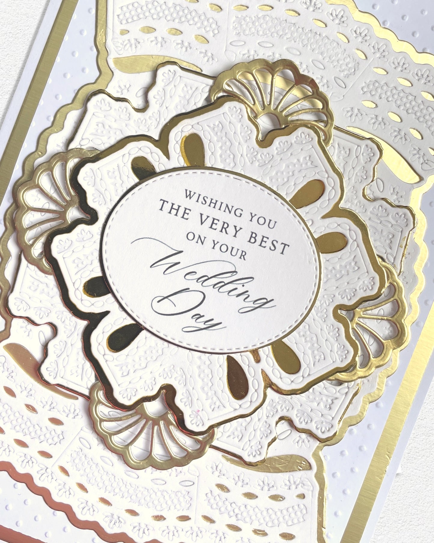 Detail shot of luxury handmade wedding card by Del Cards NZ, fine gems and elegant layered papers