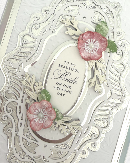 Close up detail of luxury handmade wedding card, layered papers and fine gems, made by Del Cards NZ