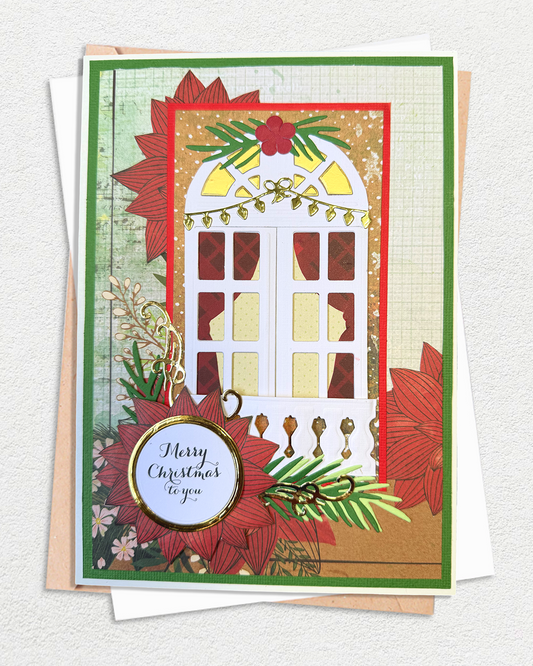 A handmade Christmas greeting card featuring a white arched window with red curtains, surrounded by red poinsettias, green pine branches, and gold glitter accents. A round tag on the front reads 'Merry Christmas to you'.
