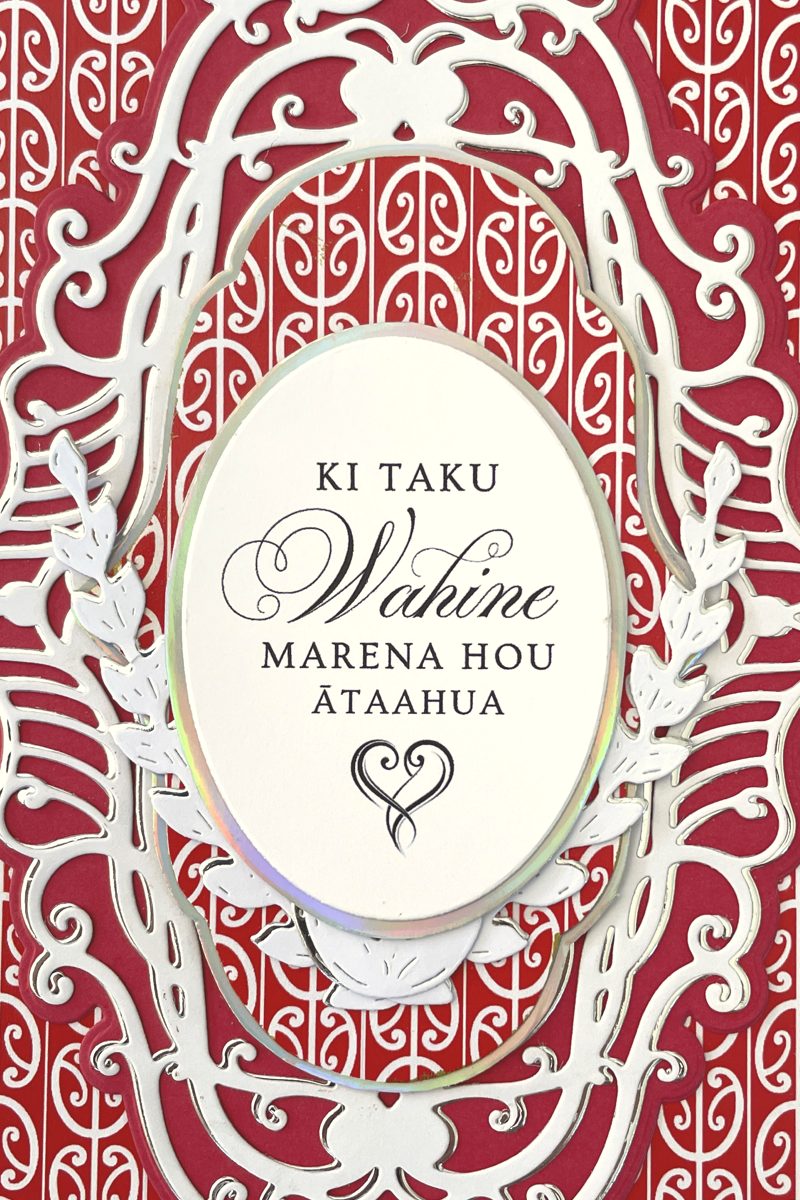 Details of luxury handmade Māori wedding card by Del Cards NZ, red and black patterned design with fine embellishments