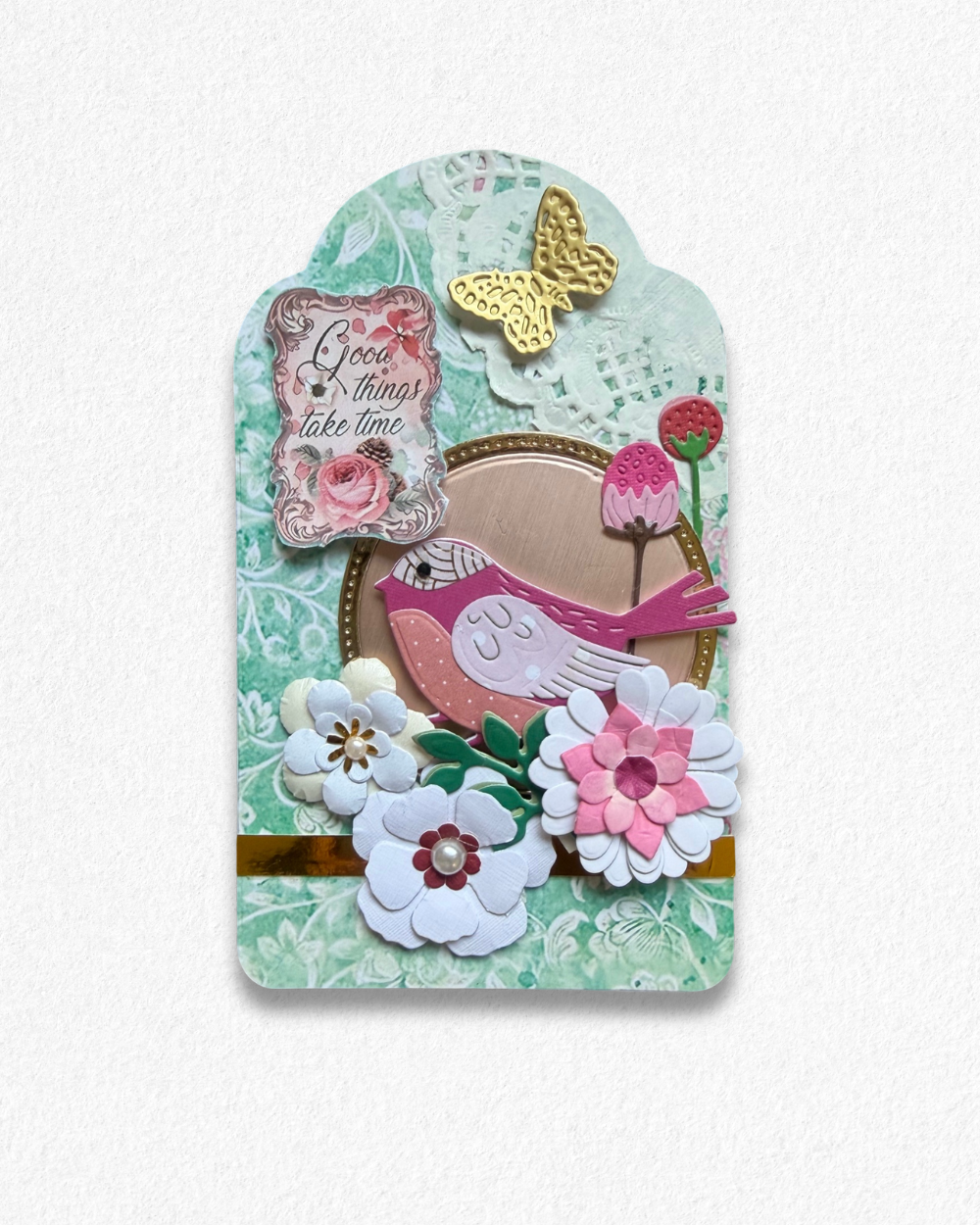 Handmade mini card by Del Cards NZ featuring a die-cut bird with floral details on a mint striped background.