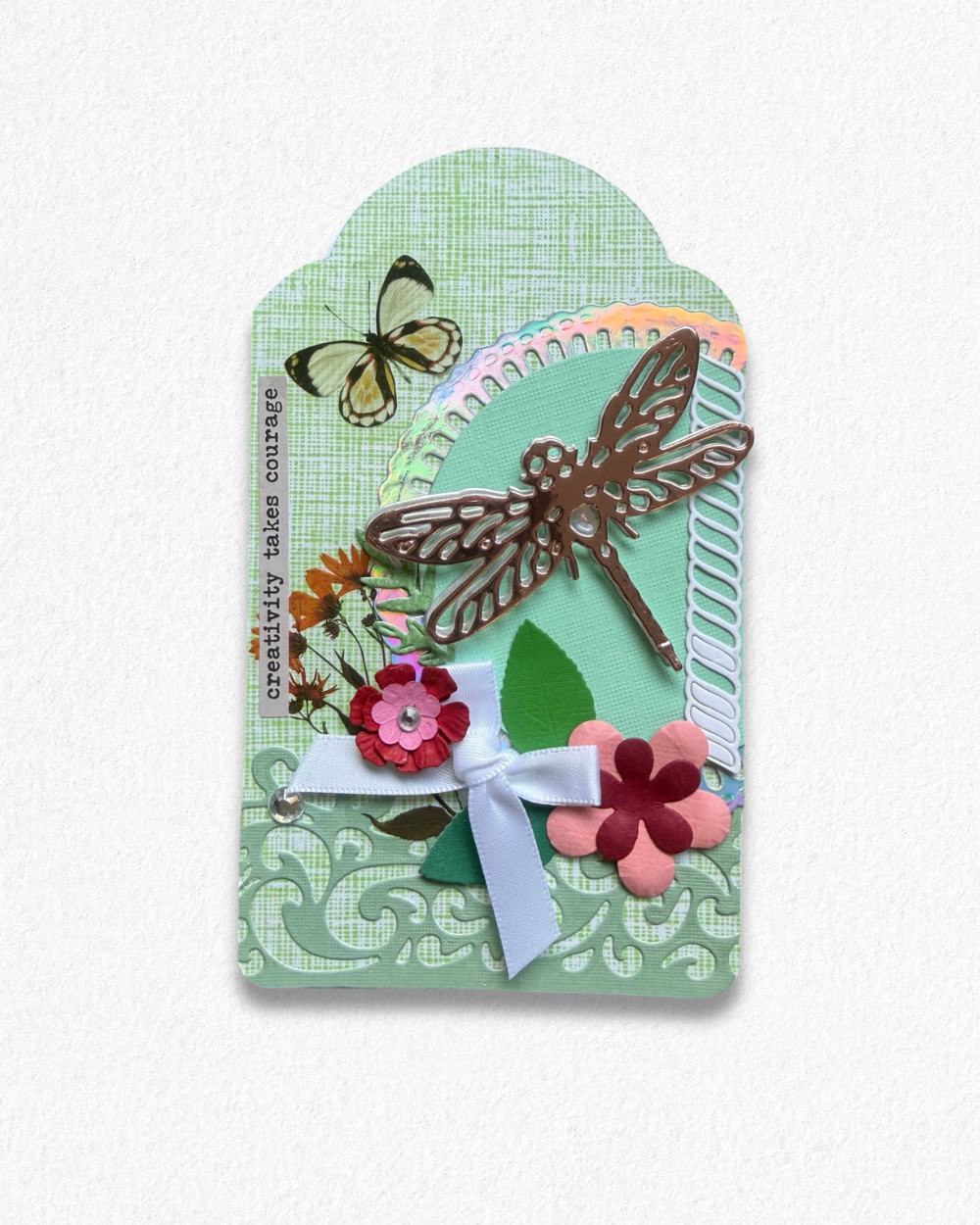 Handmade mini card by Del Cards NZ featuring a die-cut bird with floral details on a mint striped background.
