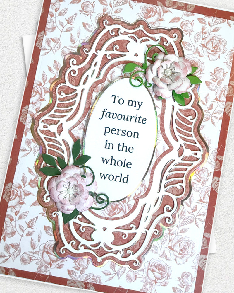 Greeting card with floral design and text 'To my favourite person in the whole world' on a floral background.