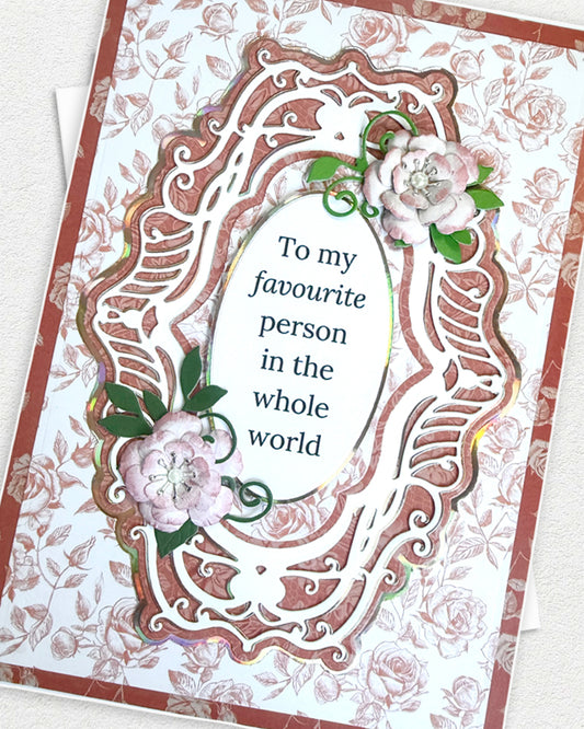 Greeting card with floral design and text 'To my favourite person in the whole world' on a floral background.