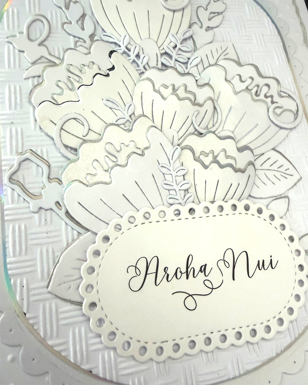 Close up  "Aroha Nui" te reo Māori greeting meaning much love, by Del Cards NZ
