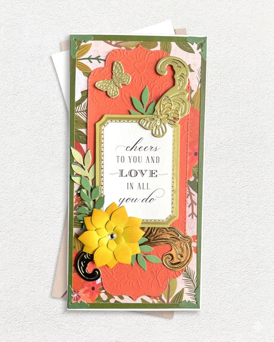Decorative greeting card with floral and butterfly design on a textured white background. Made by Del Cards in New Zealand.