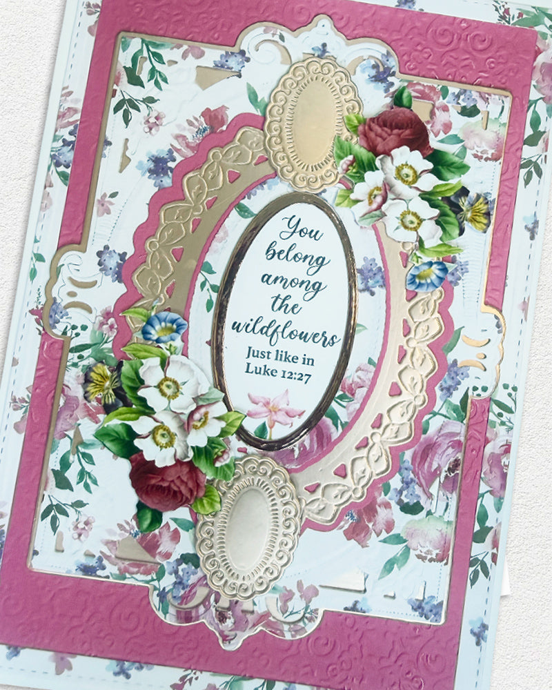 Decorative card with floral design and text, featuring a pink border.