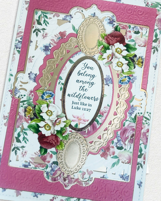 Decorative card with floral design and text, featuring a pink border.