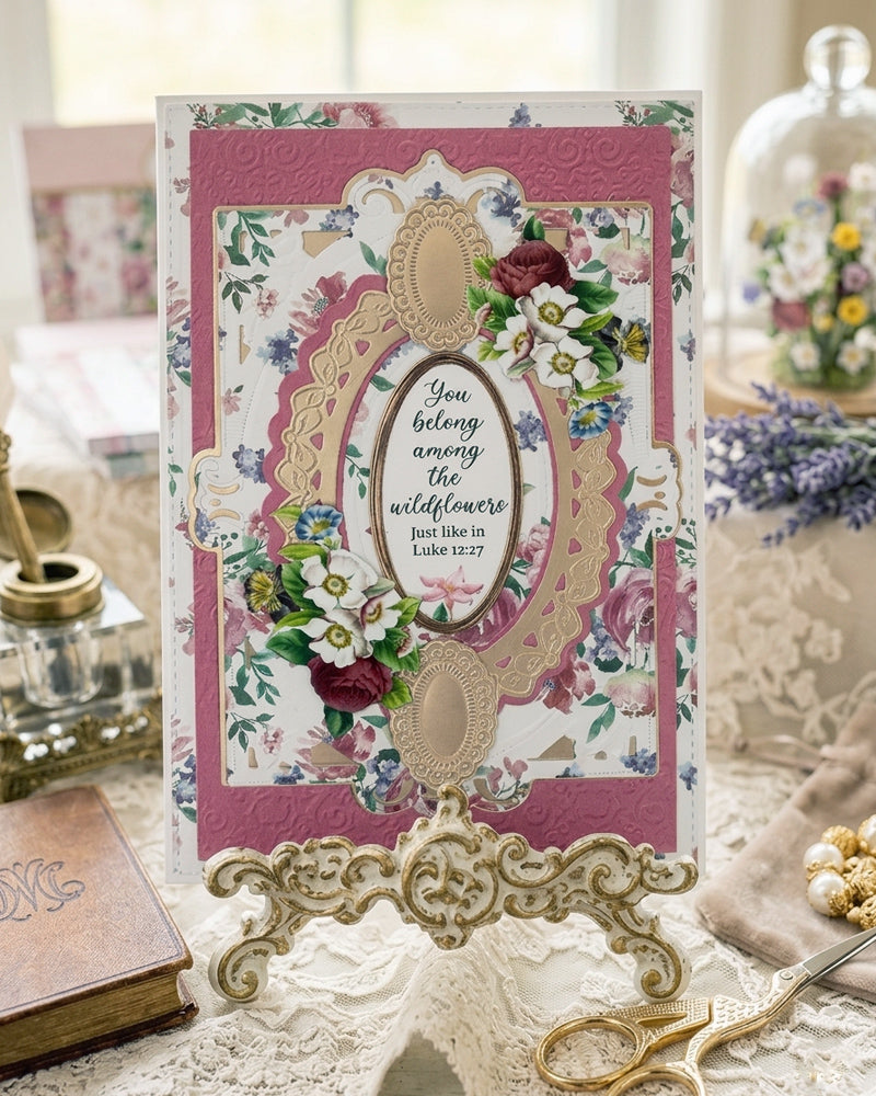 Handmade Christian greeting card in deep rose pink and gold, with floral paper, gold oval die-cut frame and Luke 12:27 sentiment, made in New Zealand by Del Cards NZ