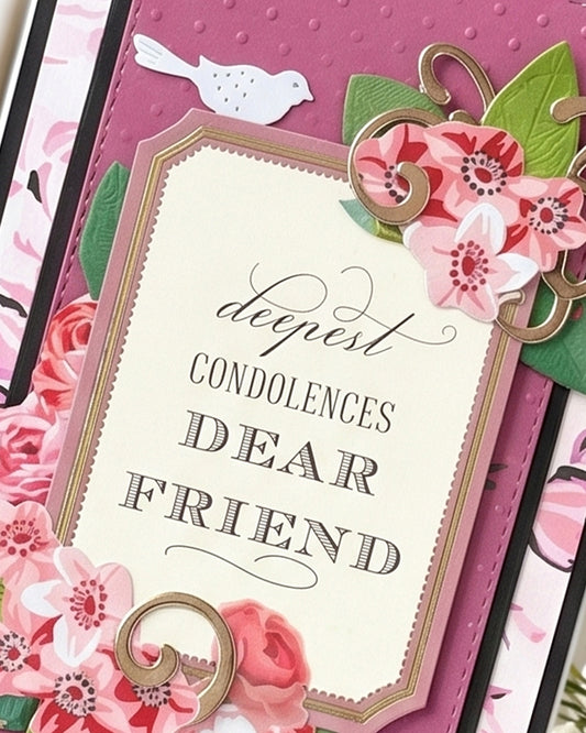 Close-up of handmade sympathy card showing layered pink roses, decorative border detail and "Deepest Condolences Dear Friend" sentiment, Del Cards NZ
