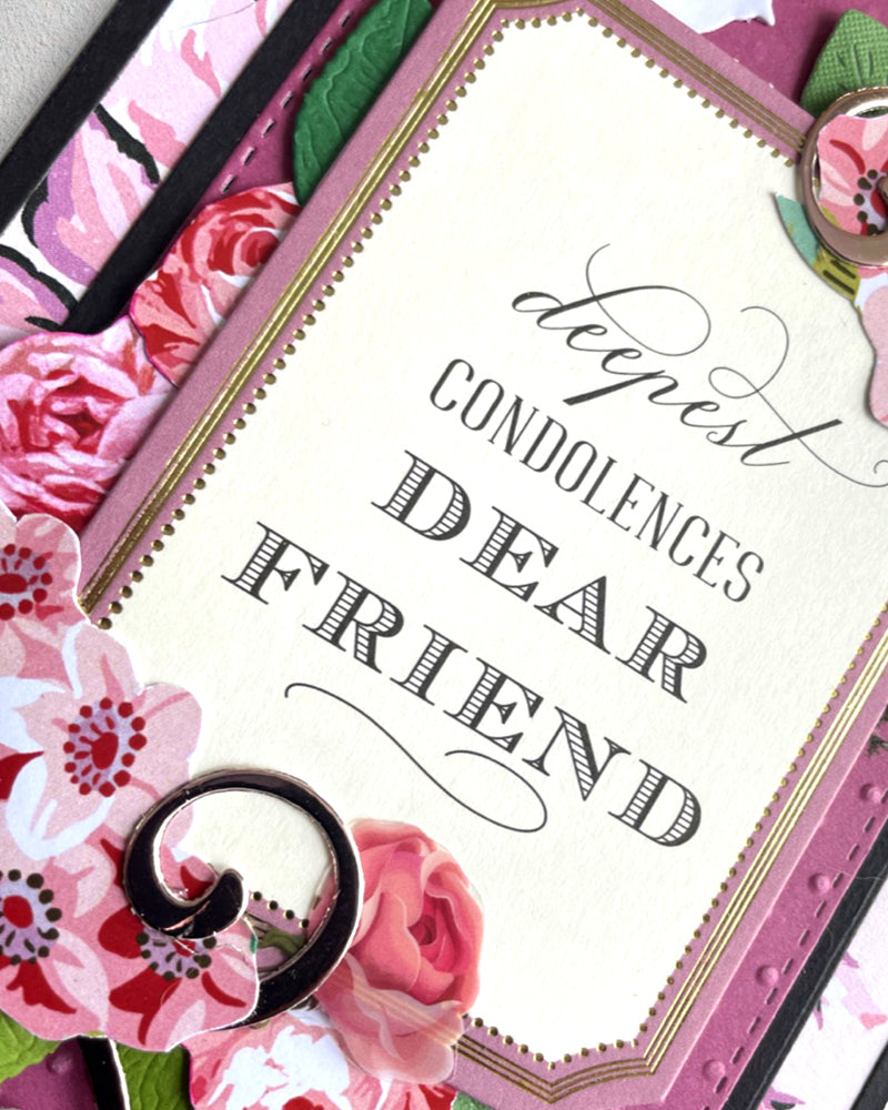 Detail shot of luxury handmade condolence card with bold "Dear Friend" lettering, pink floral embellishments and textured cardstock layers