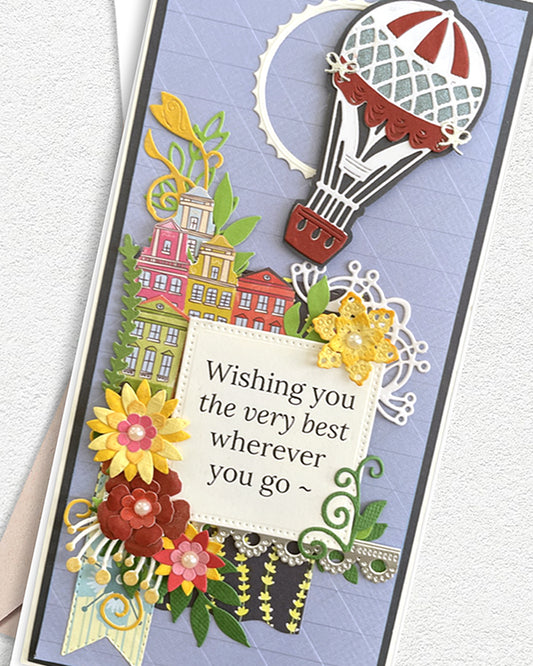 Greeting card with colorful design, hot air balloon, and flowers on a light gray background, made by Del Cards NZ