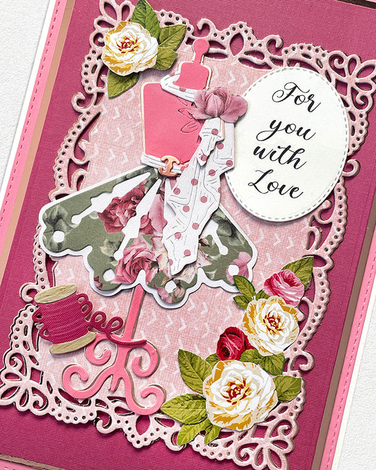 Close-up of a handmade luxury card showing an elegant lady in a detailed grey and white ball gown with pink accents, surrounded by cream and pink paper roses, within an ornate white lace die-cut frame. Circular sentiment reads "For you with Love." Handmade greeting card made in New Zealand.