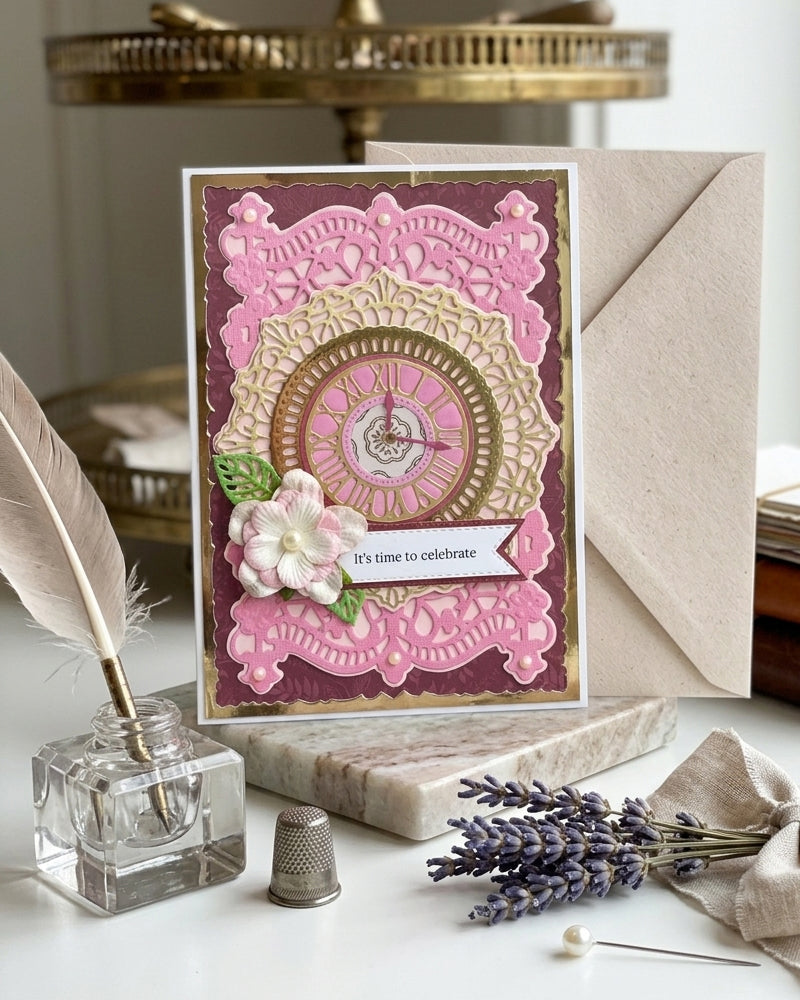 Handmade greeting card with floral design and text, placed on a surface with stationery items, made by Del Cards NZ.