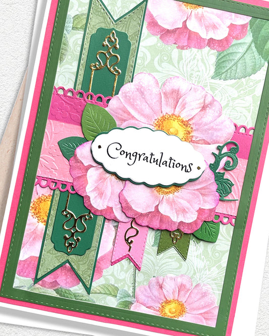 Greeting card with pink flowers and 'Congratulations' text on a white background
