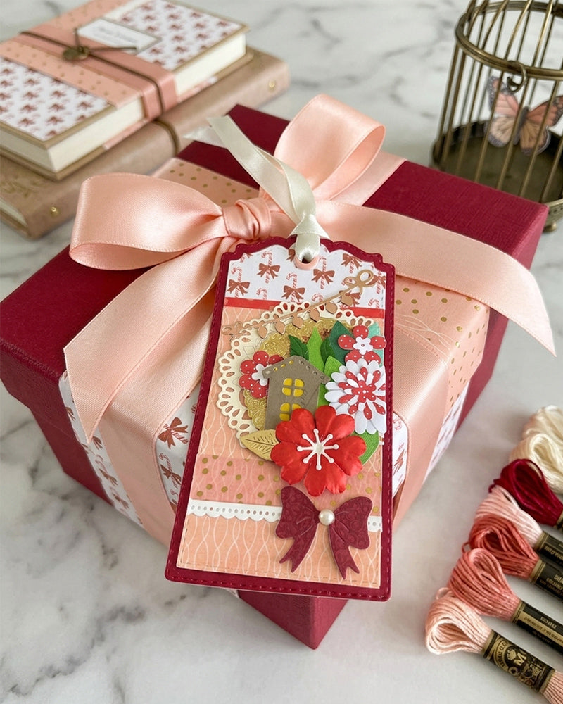 Luxury handmade Christmas gift tag styled on wrapped gifts with pink satin ribbon — Del Cards NZ handmade gift tags add a personal touch to any Christmas present