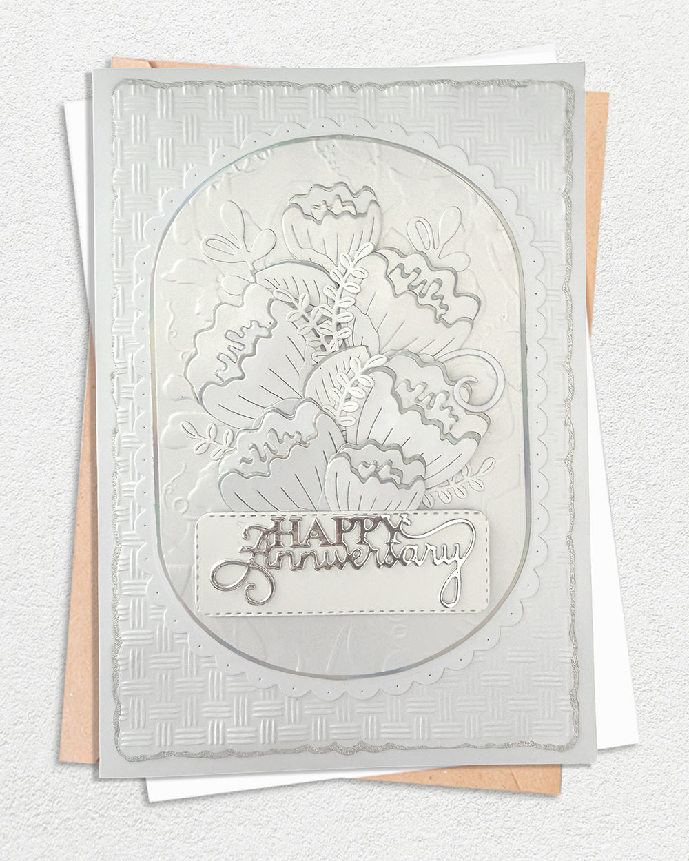 White embossed Happy Anniversary card with silver foil floral design and matching envelope – Del Cards NZ