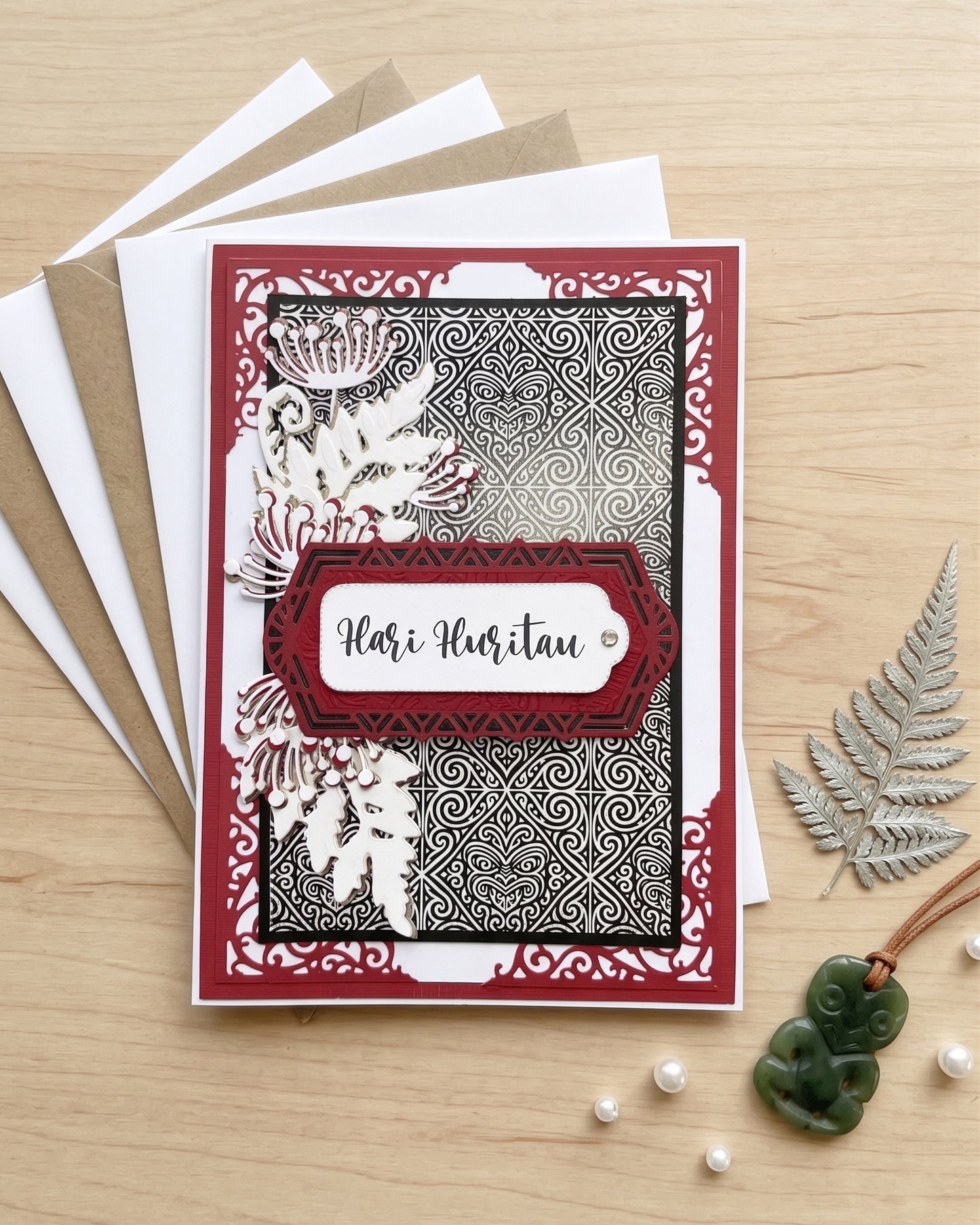 Detail shot of luxury handmade Māori birthday card by Del Cards NZ, unique design with premium embellishments