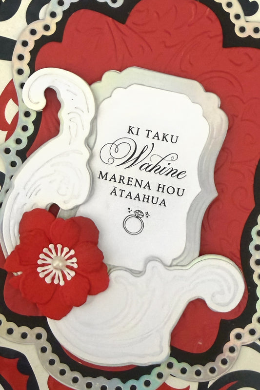 Detail shot of luxury handmade Māori wedding card by Del Cards NZ, decorative floral design with traditional Māori patterning