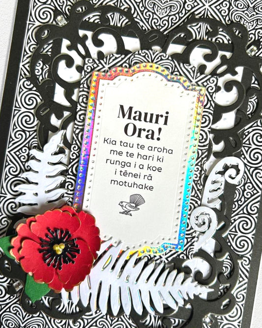 Detail shot of luxury handmade Māori celebration card by Del Cards NZ, unique design with premium embellishments
