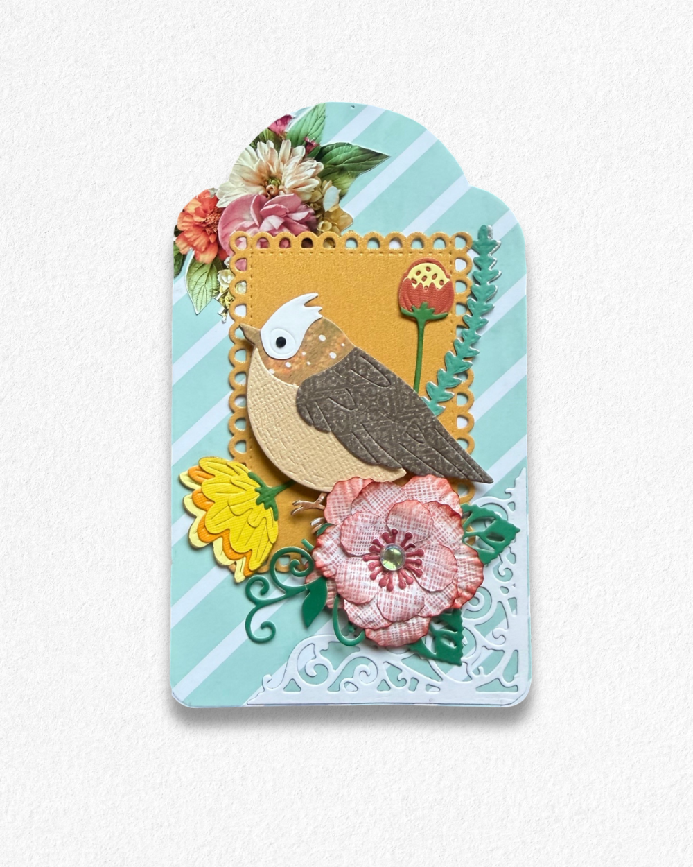 Handmade mini card by Del Cards NZ featuring a die-cut bird with floral details on a mint striped background.