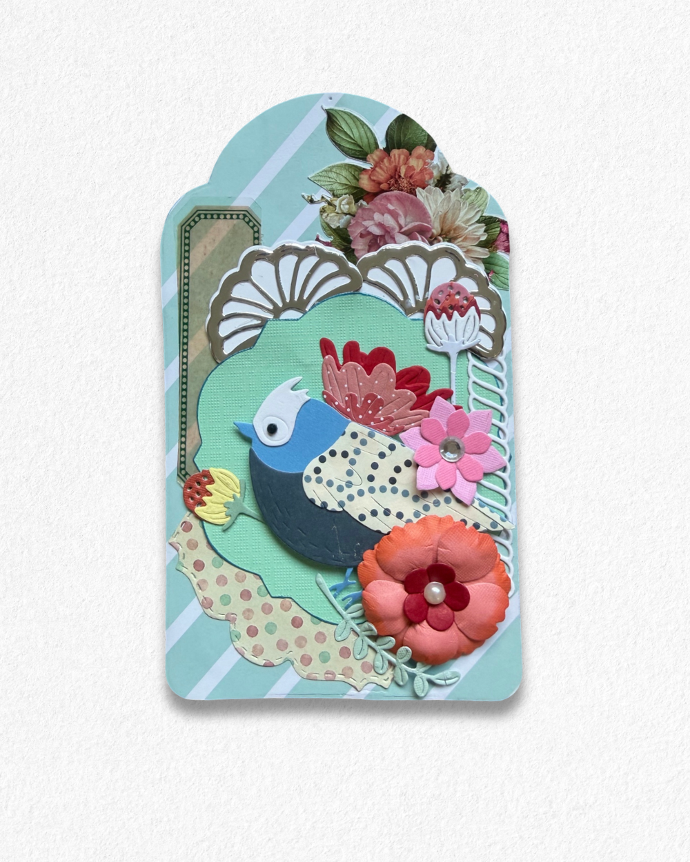 Handmade mini card by Del Cards NZ featuring a die-cut bird with floral details on a mint striped background.