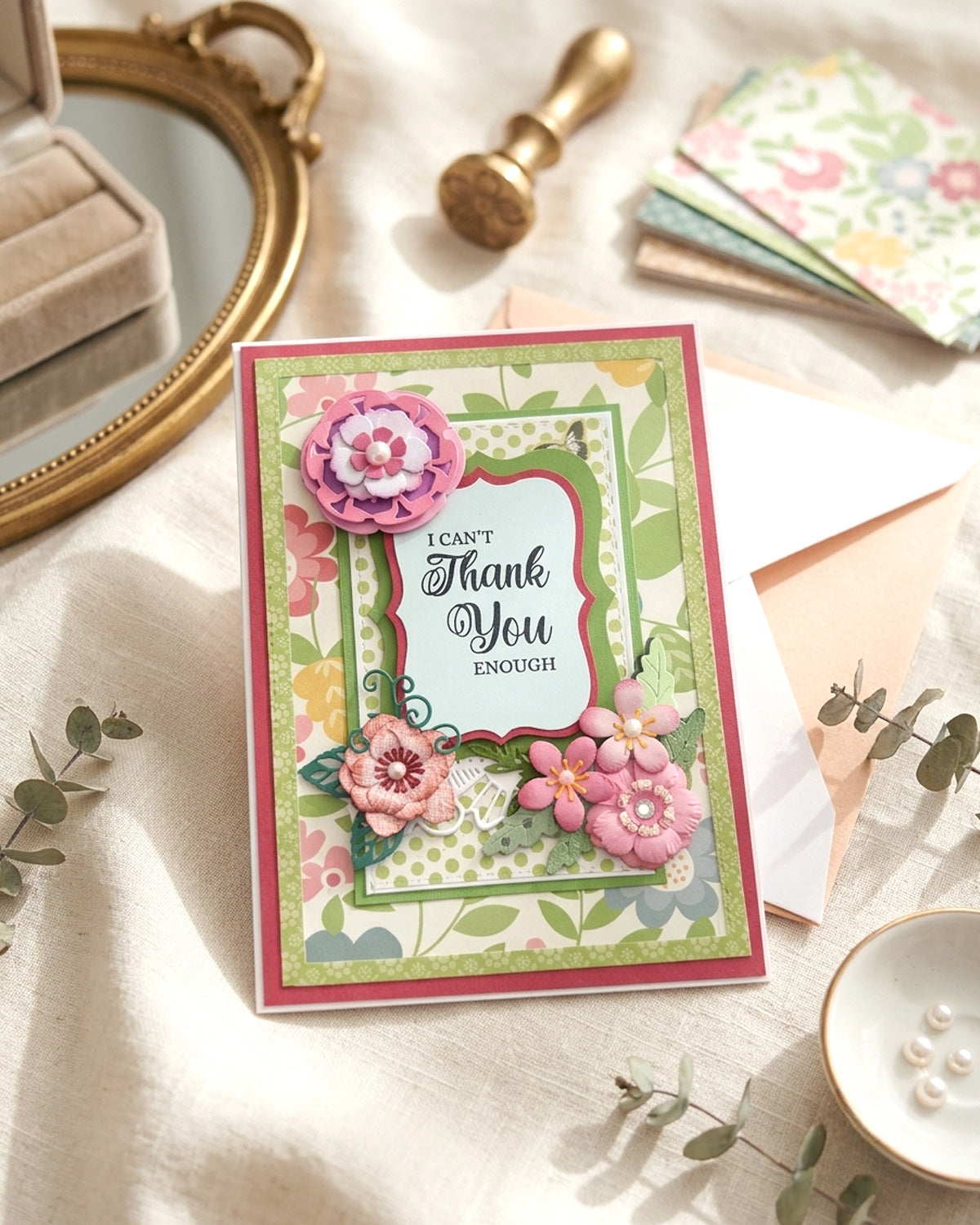 Handmade thank you card styled flat lay with vintage mirror, ribbon and dried flowers, made in New Zealand by Del Cards.